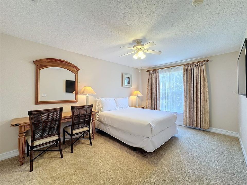 The spacious guest bedroom above the garage.