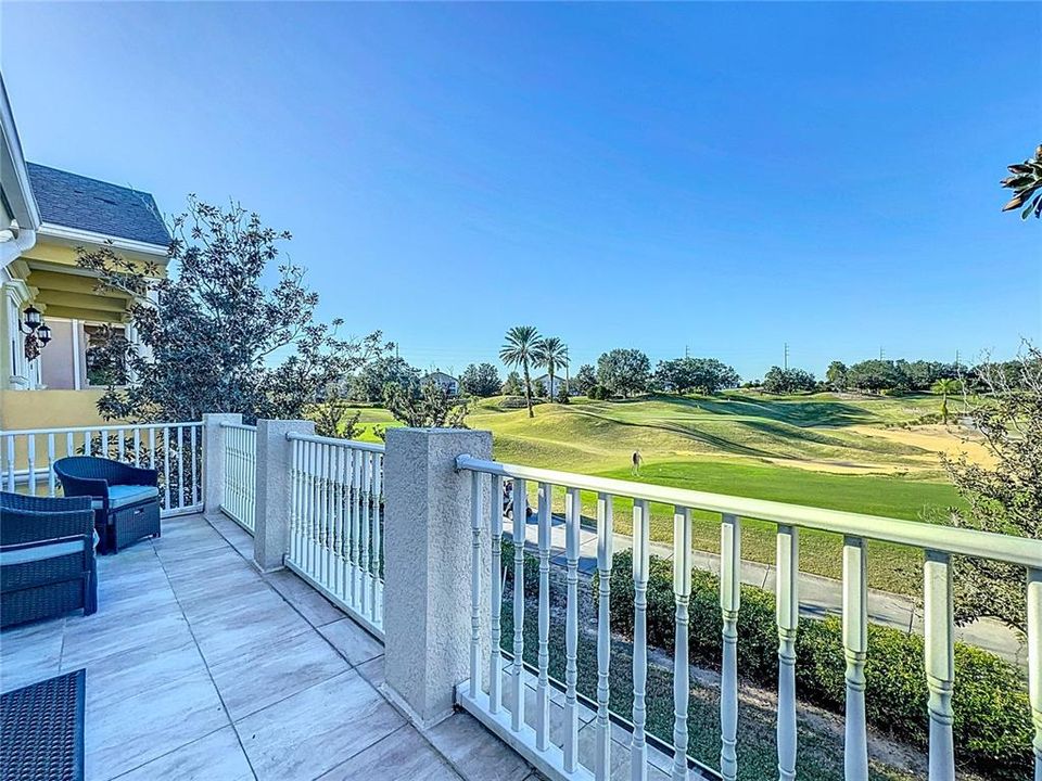 The balcony is a peaceful, open-air retreat that offers breathtaking views of the golf course below.