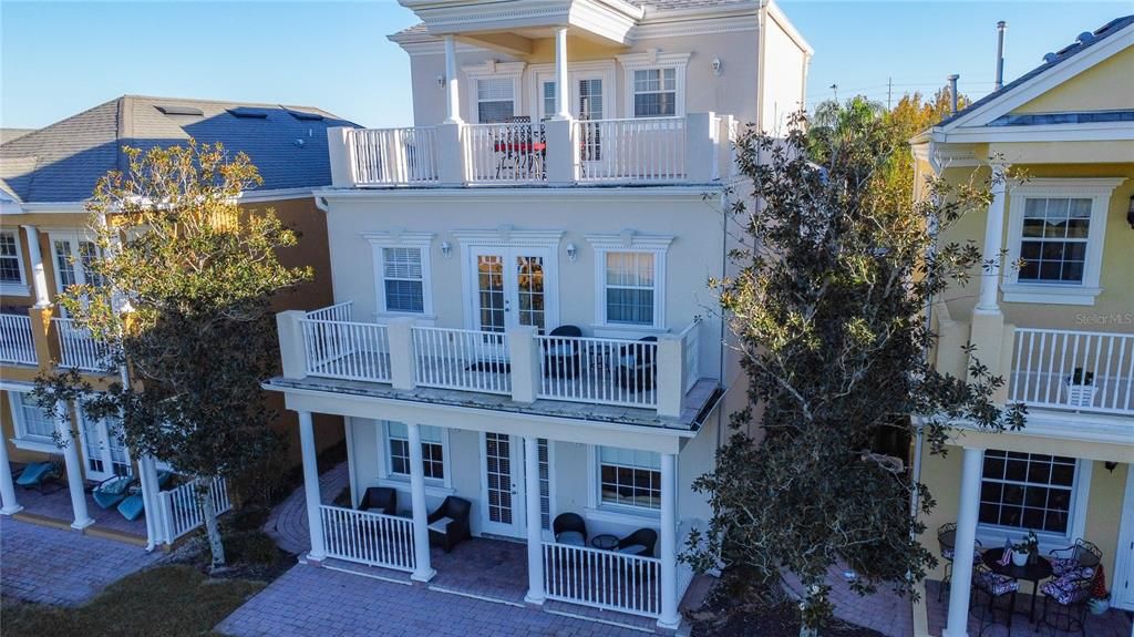 The windows and French doors are strategically placed throughout the home, offering panoramic views of the landscape with its lush green of the golf course.