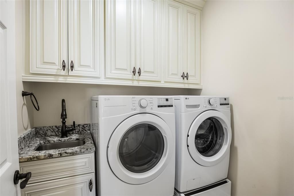 Inside laundry room, new washer & dryer