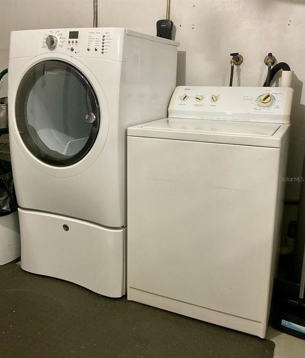 Washer and dryer in garage area