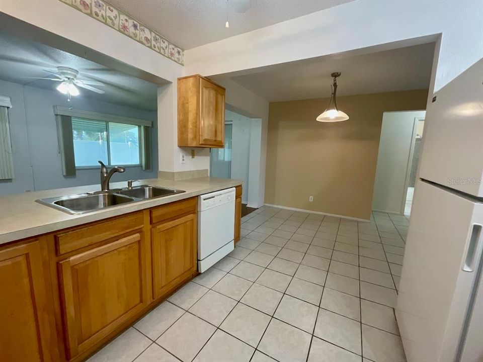 Kitchen view to dining room and family room