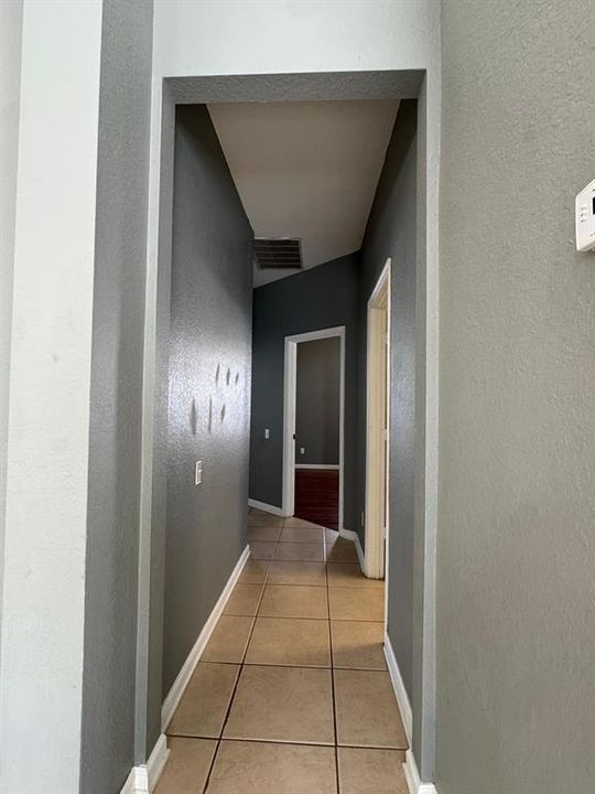 Hallway to primary bedroom