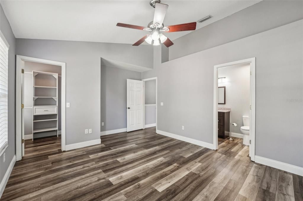 Large master bedroom with walk-in closet and direct access to the bathroom.