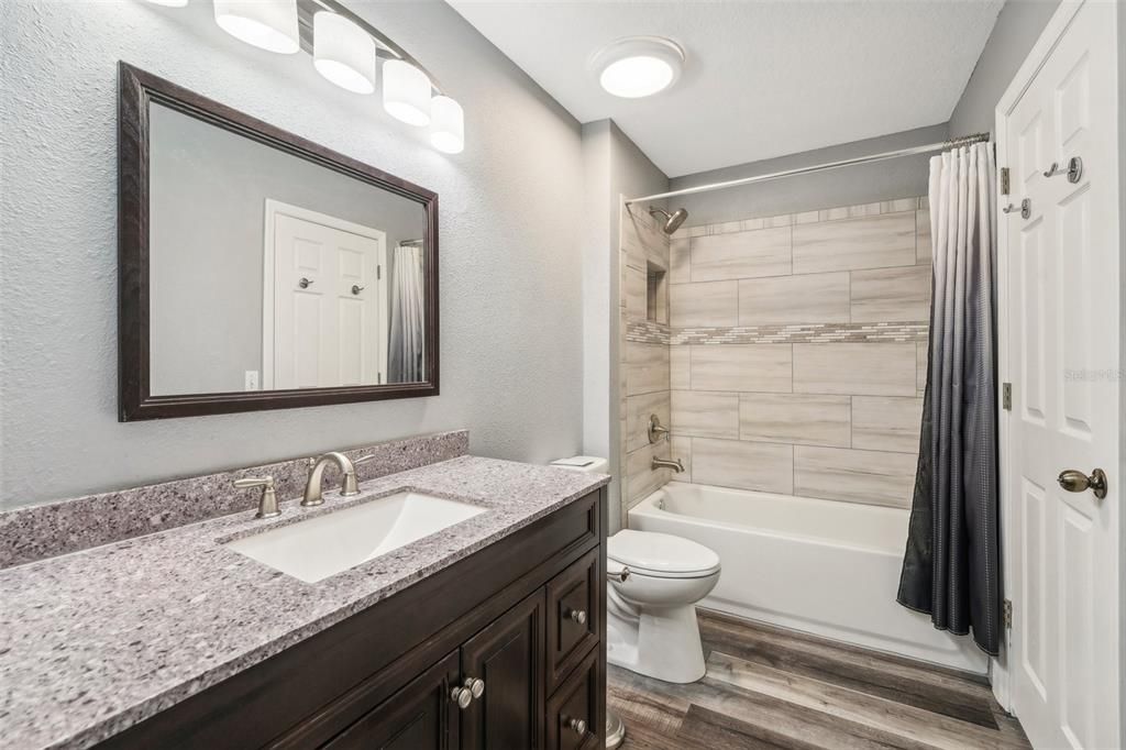 Nicely updated full bathroom upstairs with shower and tub.