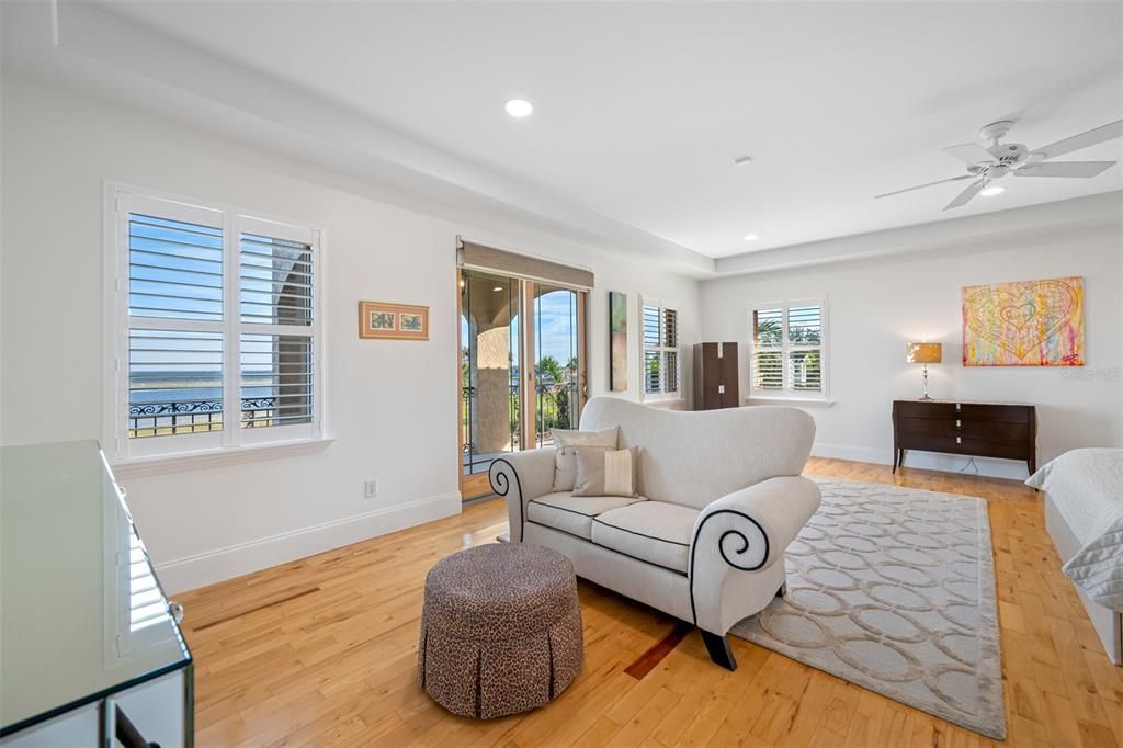 Primary sitting area with balcony access