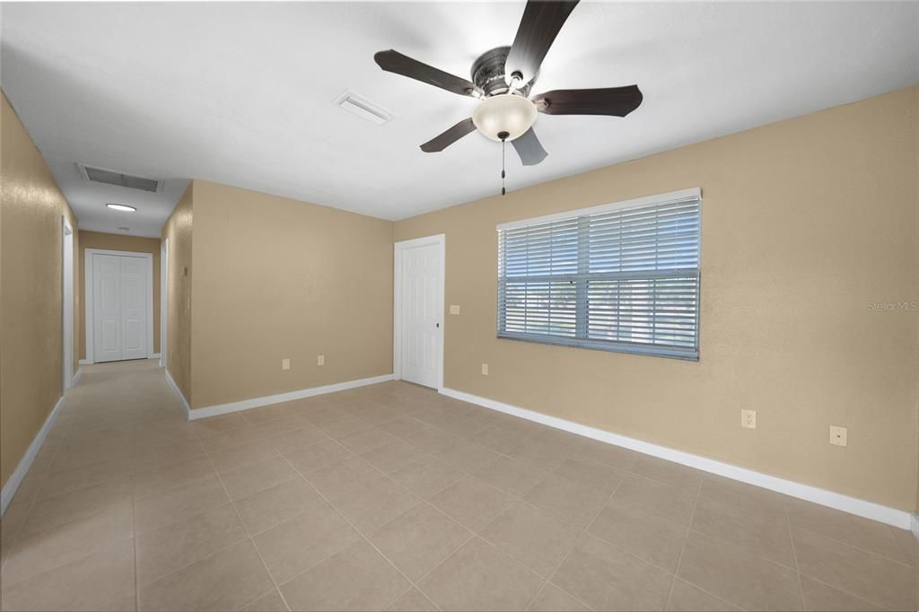 LIVING ROOM WITH HALLWAY TO GUEST BEDROOMS