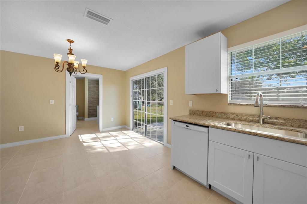 KITCHEN VIEW TO DINING ROOM WITH PRIMARY BATH IN BACKGROUND