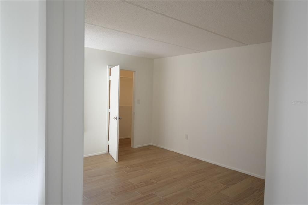 Primary bedroom with one of two large closet. New Luxury vinyl floor