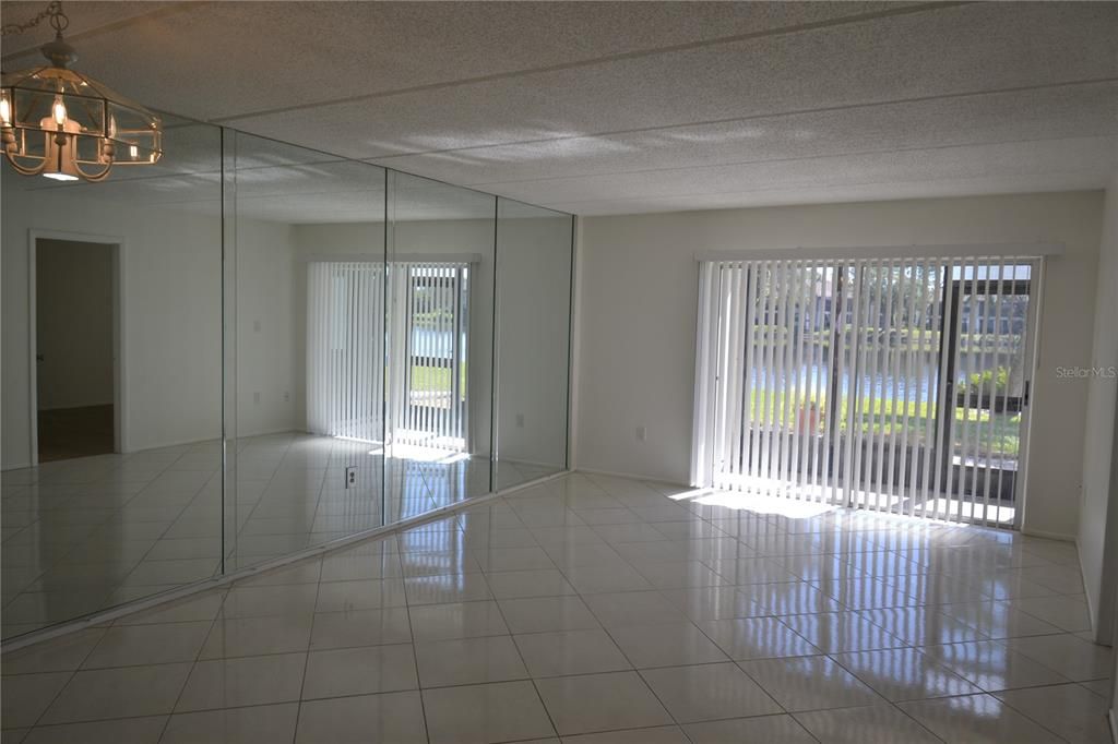 Mirrored wall on left and dining light