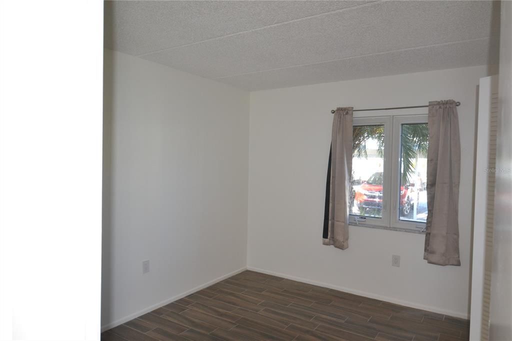 Guest bedroom with hurricane resistant windows