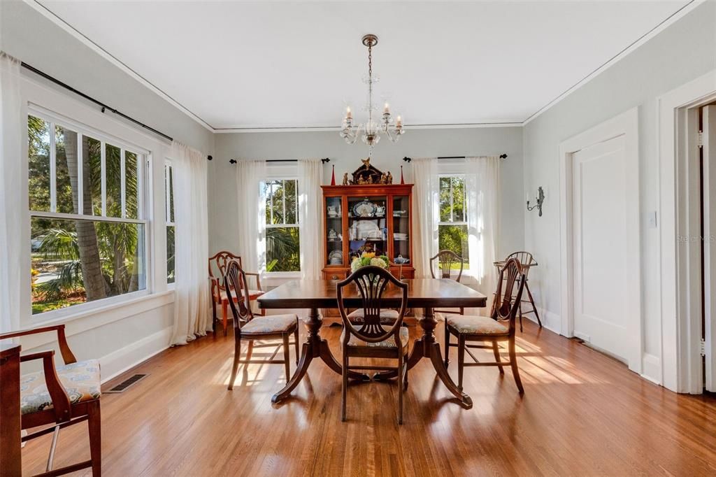 This beautiful formal dining room with sparkling chandelier provides the perfect backdrop for gathering friends and family