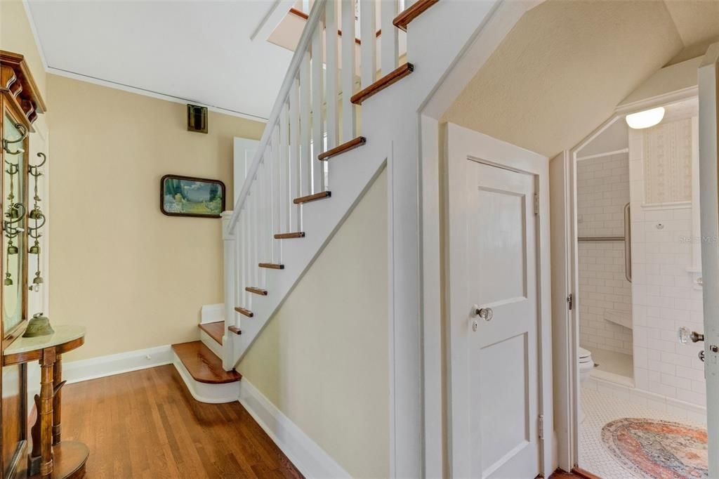 The millwork wasn't spared for this cupboard under the stairs. The guest bath has been remodeled but it has retained every ounce of it's original charm