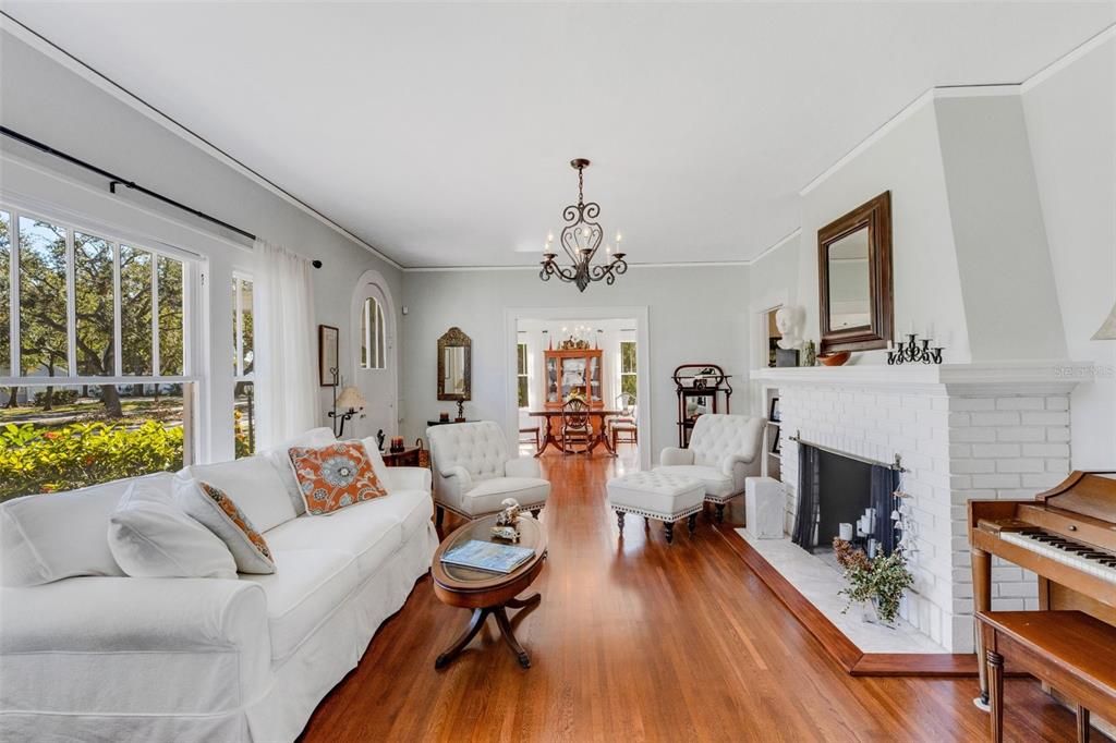 Dual cased openings flank the living room; this one leads to the formal dining room