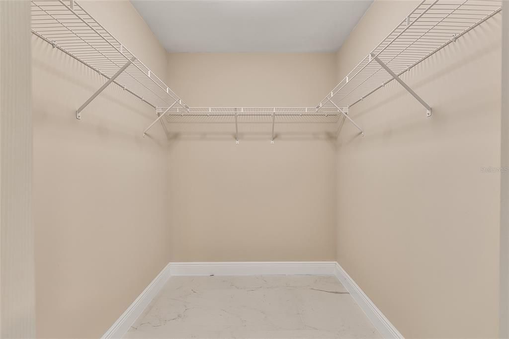 Walk in closet in guest bathroom