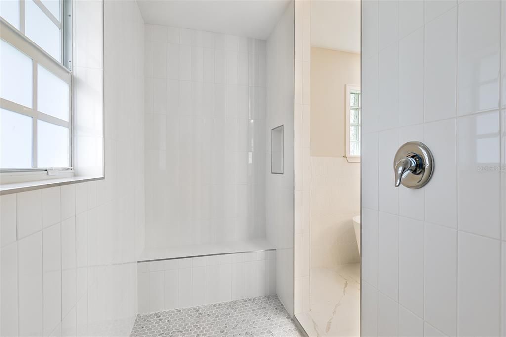 Oversized walk in shower in primary bathroom