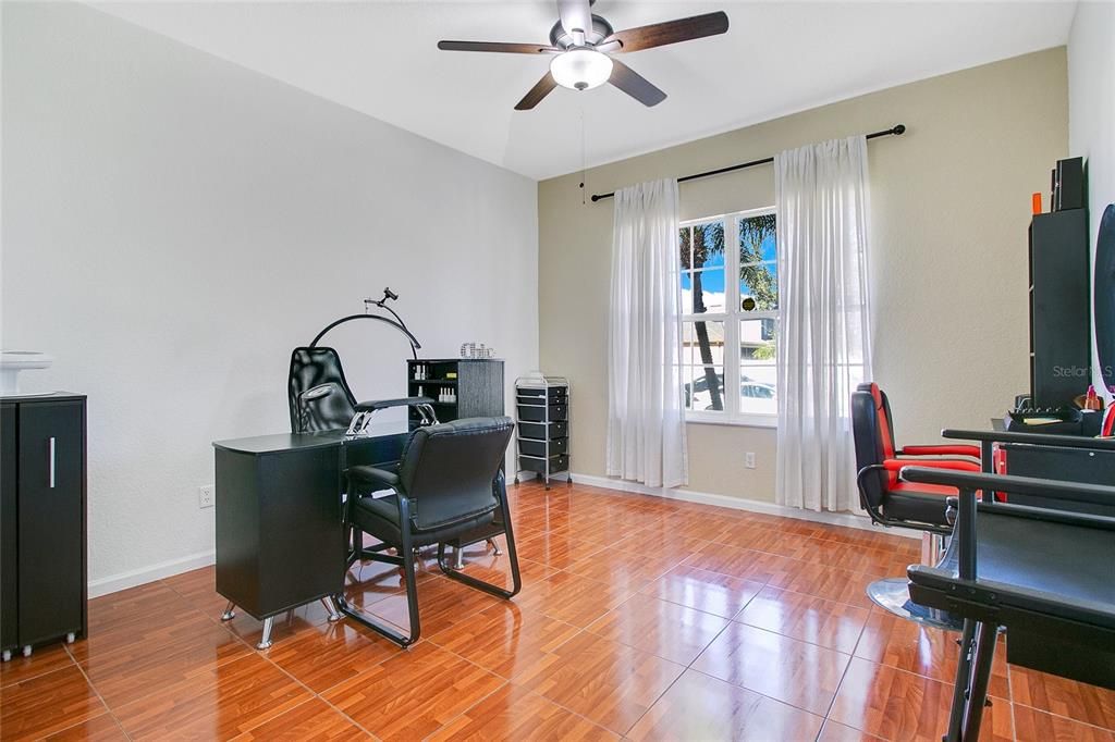 Cozy and versatile first-floor bedroom with a built-in closet, offering a perfect space for guests, a home office, or a playroom.