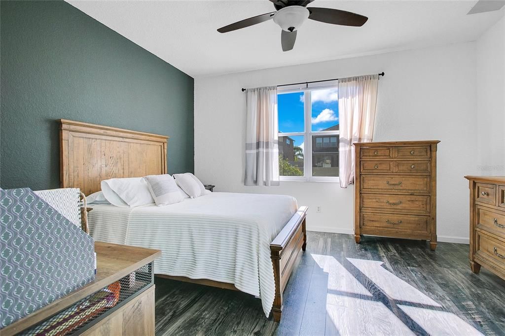 Luxurious master suite with a walk-in closet and an en-suite bathroom that includes a soaking tub, dual vanities, and a separate shower for a true retreat experience.