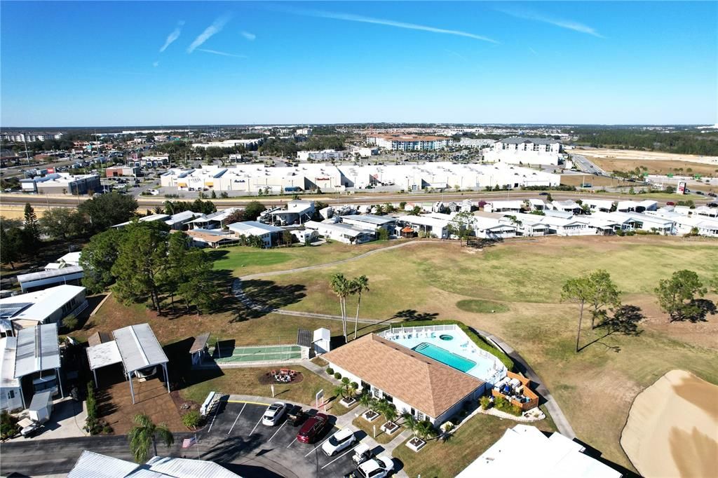 Osprey Clubhouse & view of 7th hole