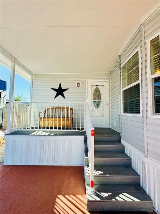 Covered side porch off of 2nd bedroom