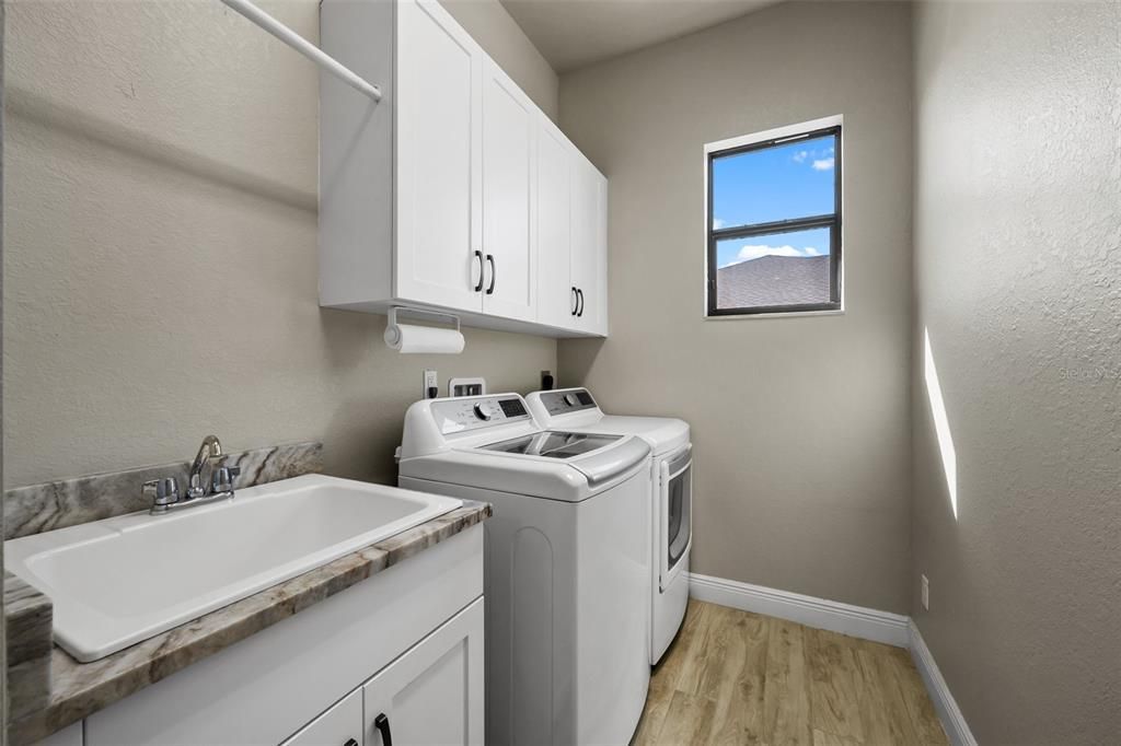 Laundry room with tub