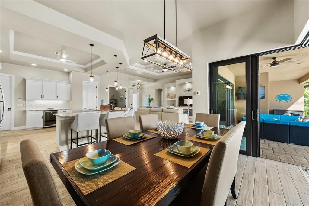 Dining overlooking the lanai, pool and water