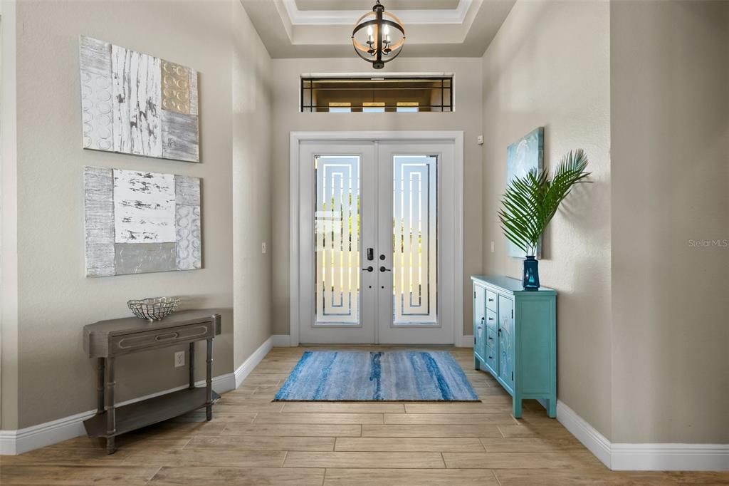 Front double doors with transom window in Foyer