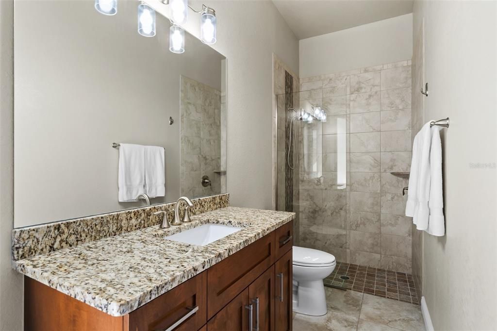 This Bathroom is also a ensuite bathroom with patio access to the pool.