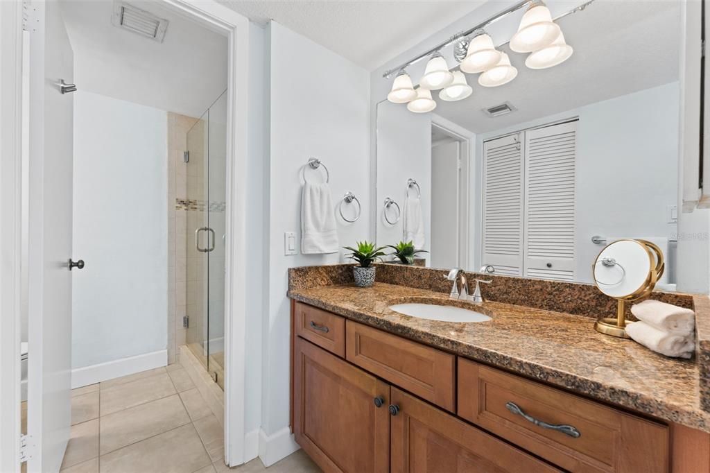 Primary Suite Bathroom, with separate vanity area.