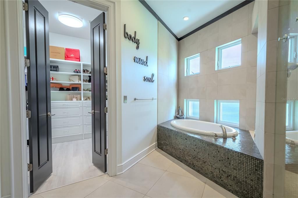 Relax and recharge in this ensuite oasis, complete with a jetted tub for ultimate comfort.