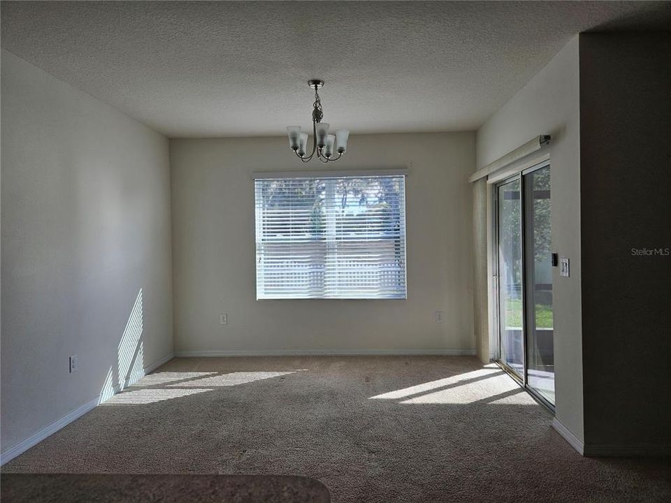 Dining room  with sliding doors  on right to screened patio