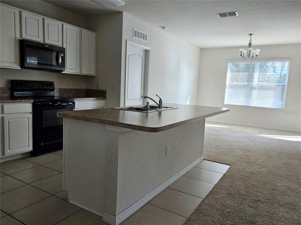 Kitchen next to dining room