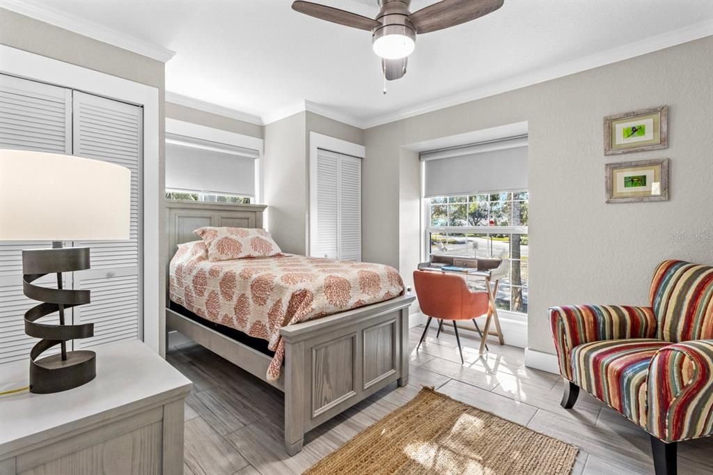 Guest bedroom in front of the house with dual closets