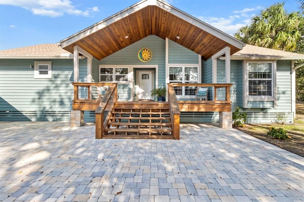 View of front entry with paver patio