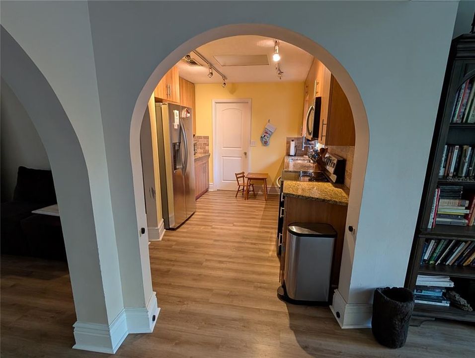 Looking from the great room to the beautiful kitchen, did we mention the arches?!?!