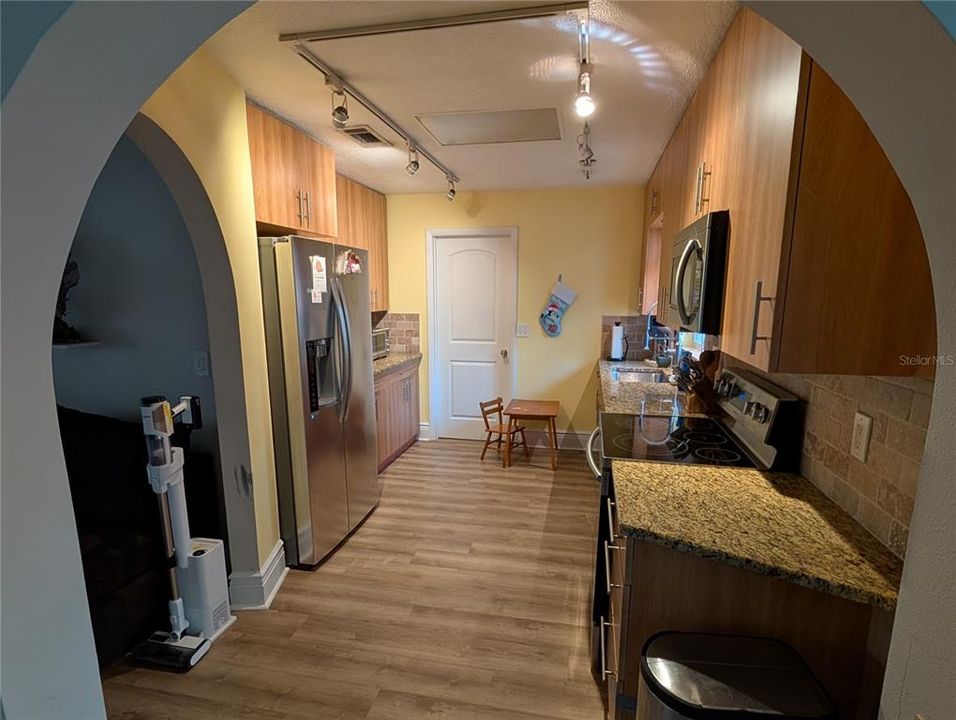 Granite counters, updated appliances and new cabinets and, of course, the arches, make for a beautiful kitchen!