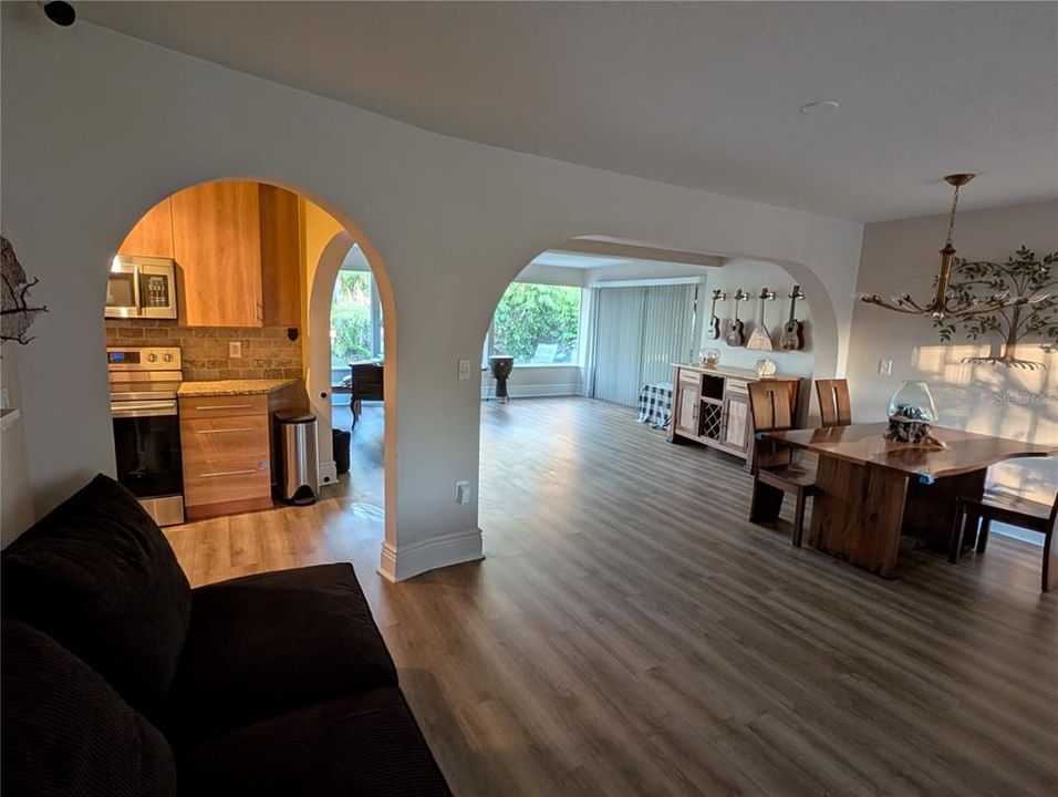 Looking in from the front door, towards the kitchen, great room and dining area, and more arches!!