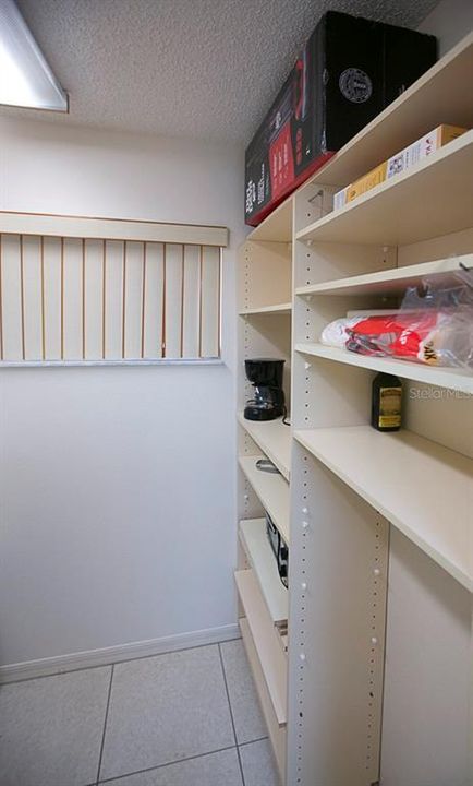 storage on opposite wall of laundry room