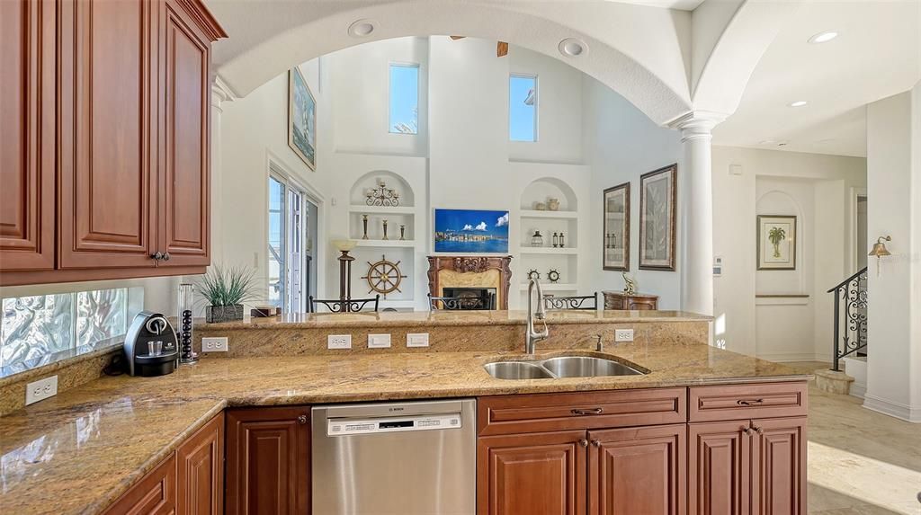 Kitchen with arches & columns into Great Room