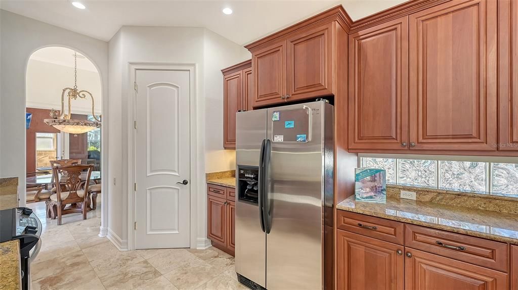 Walk in pantry door & entrance to formal dining room.