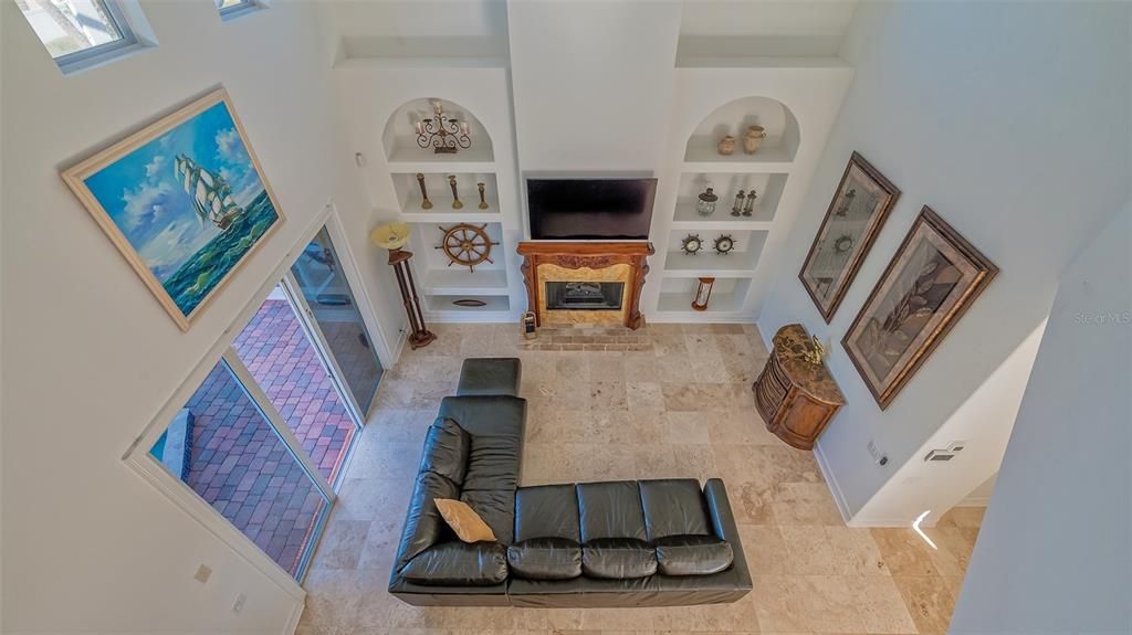 Overhead view of Living Area to hallway on right to Guest Bedroom & Bath.