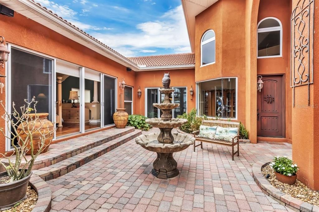 Courtyard with entrance to Master Bedroom on Left & Door to Foyer straight ahead.