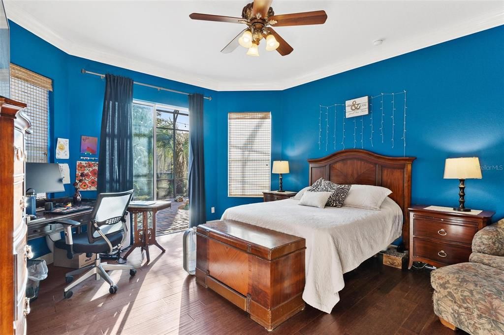 Primary Bedroom with Sliding Doors leading to Lanai and Pool Area