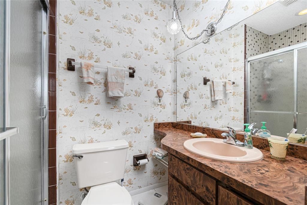 Enjoy lots of counter space with a long vanity in the main bath.