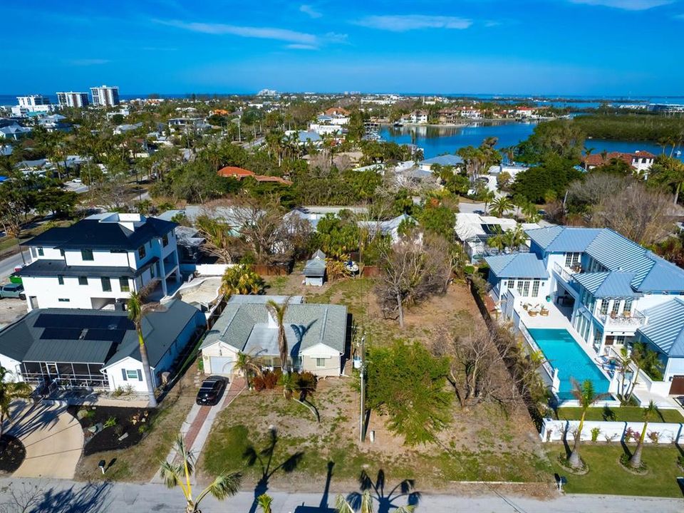 Luxury homes on either side.