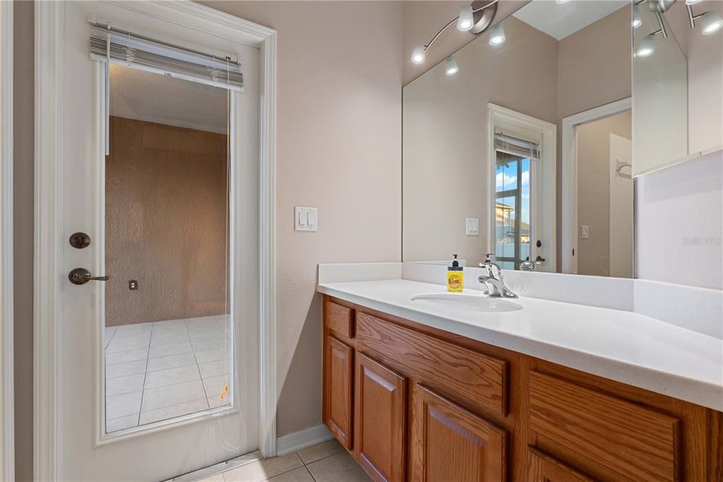 bathroom 3 with door leading to Rear enclosed porch