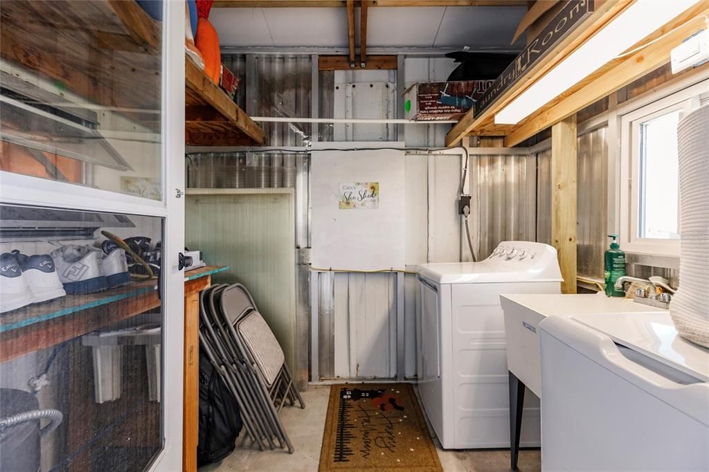 Laundry room with new washer and dryer