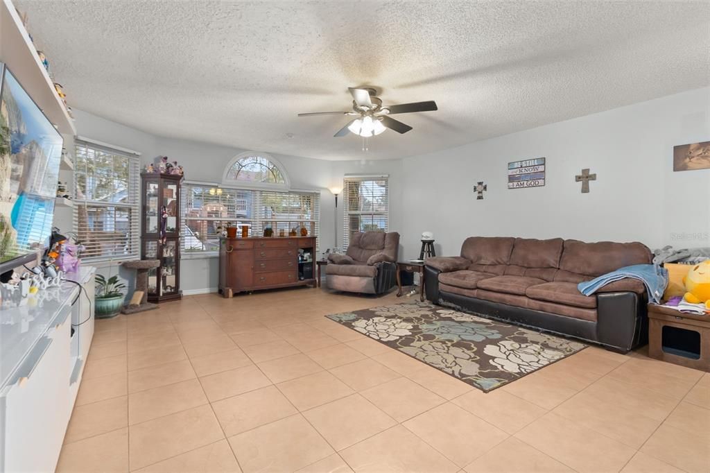 Spacious living room with ample windows