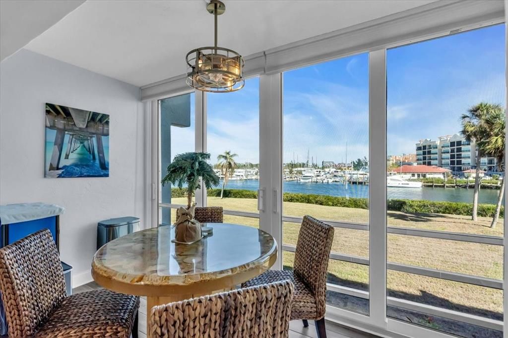 Relax and watch the boats, dolphins, birds, and sunsets or sunrises from the enclosed Florida room.  The doors are impact resistant and keep out noise and weather. Open the doors and you have screened area to let the breeze flow through.  Above the table is a fan light.