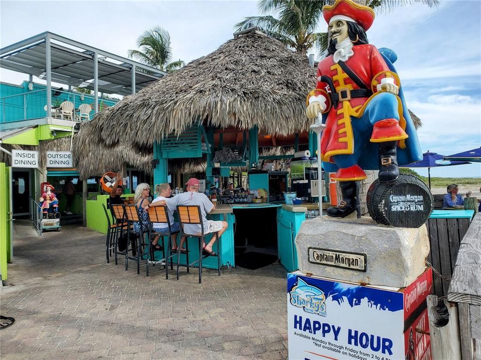 Sharky's outdoor tiki and upstairs dining for great sunset viewing.  This is a 7 minute drive from the condo